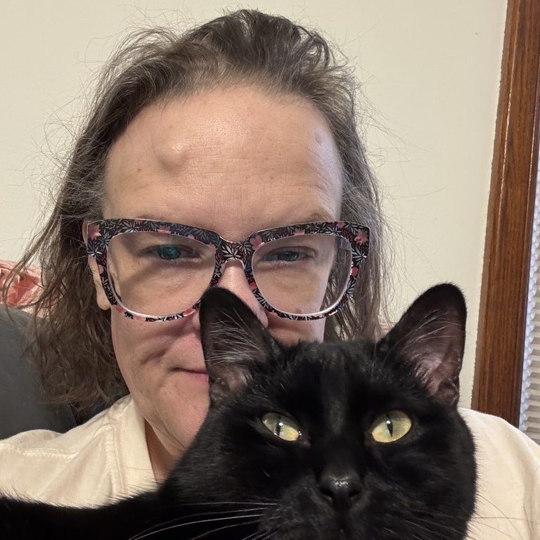 A group photo of the I Luv Cheap Frills team: Melissa and Poe